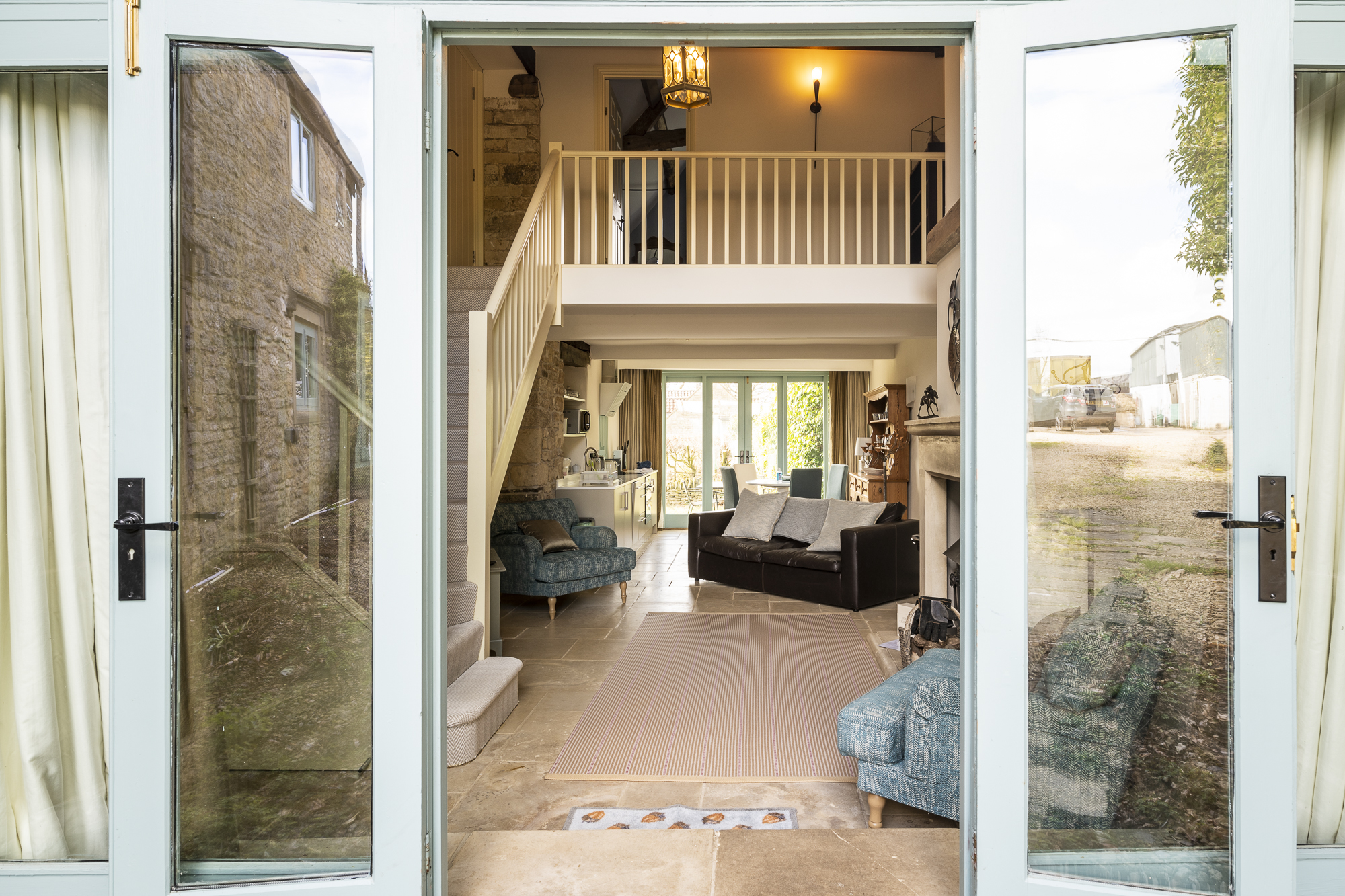 looking through tall glass doors to interior of The Hall